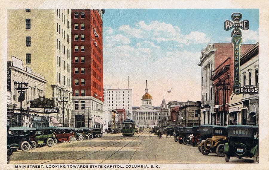 Post card showing a streetcar traveling down Columbia's main street