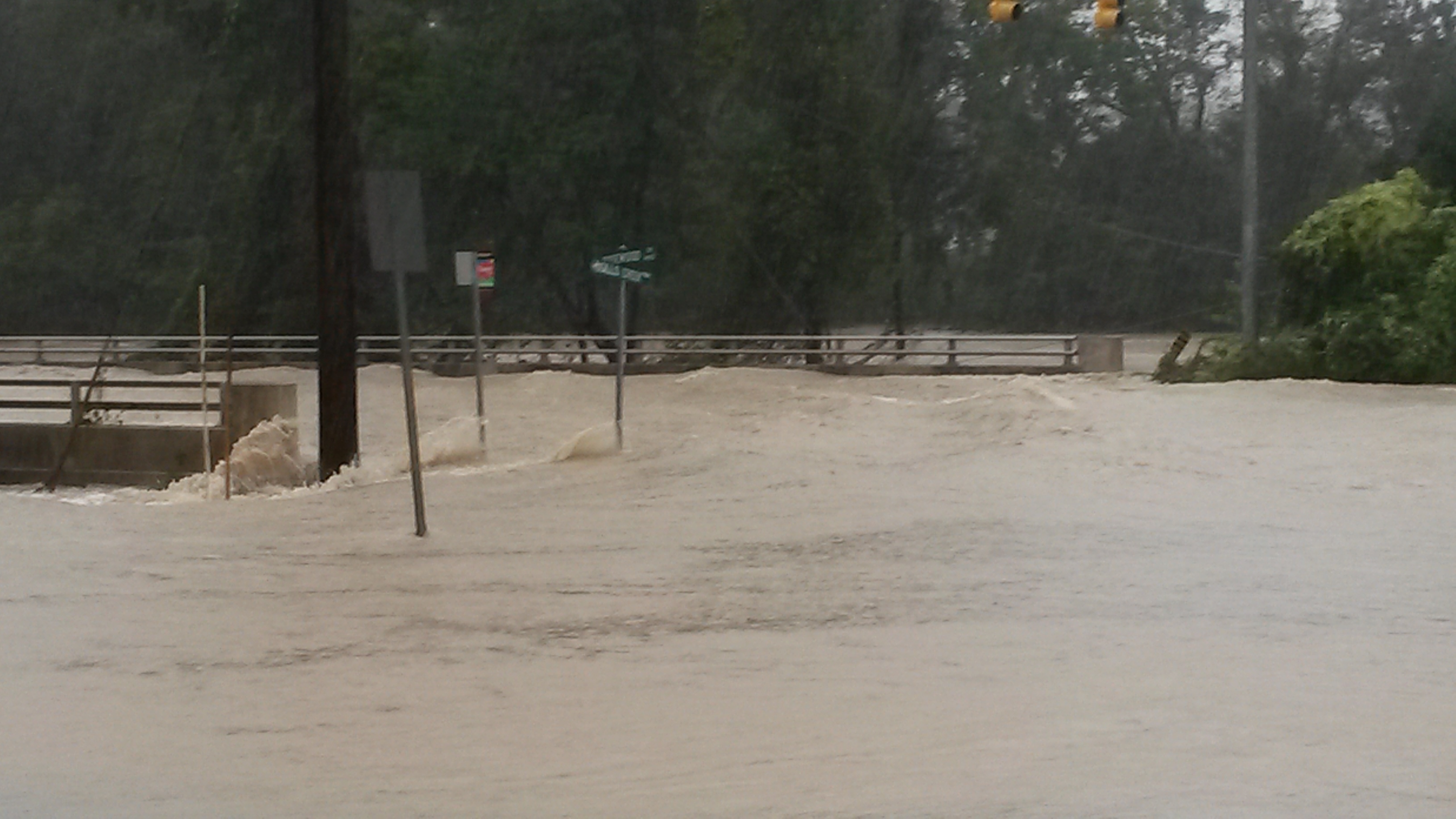 photo of Gills Creek flooding roadway